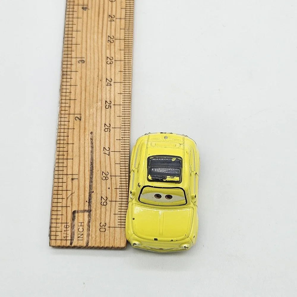 Disney Pixar Cars Luigi Yellow Diecast Car 95 Flame Side Toy Loose 2.5 Inch